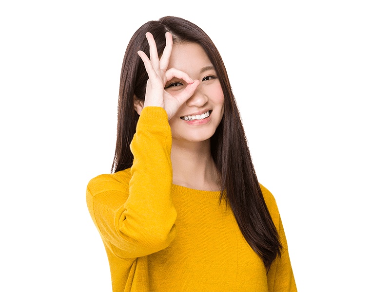 women with dark brown hair holding her hands by her eyes