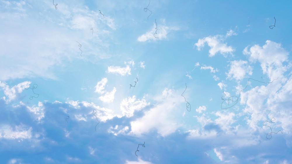 Image of clouds with little black squiggles floating throughout the image