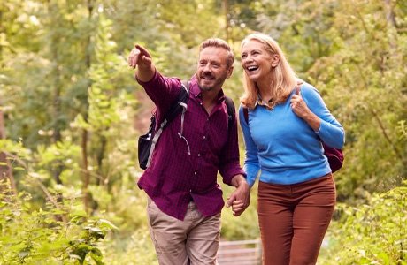 middle aged couple hiking together